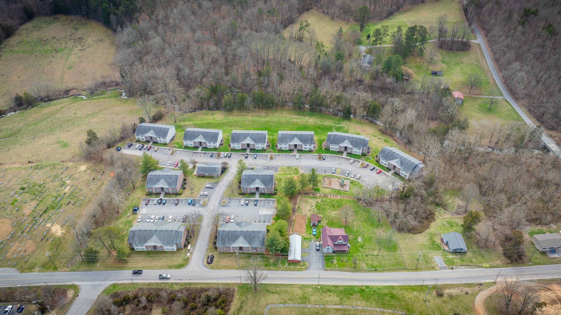An aerial view of a residential area with lots of houses and trees.