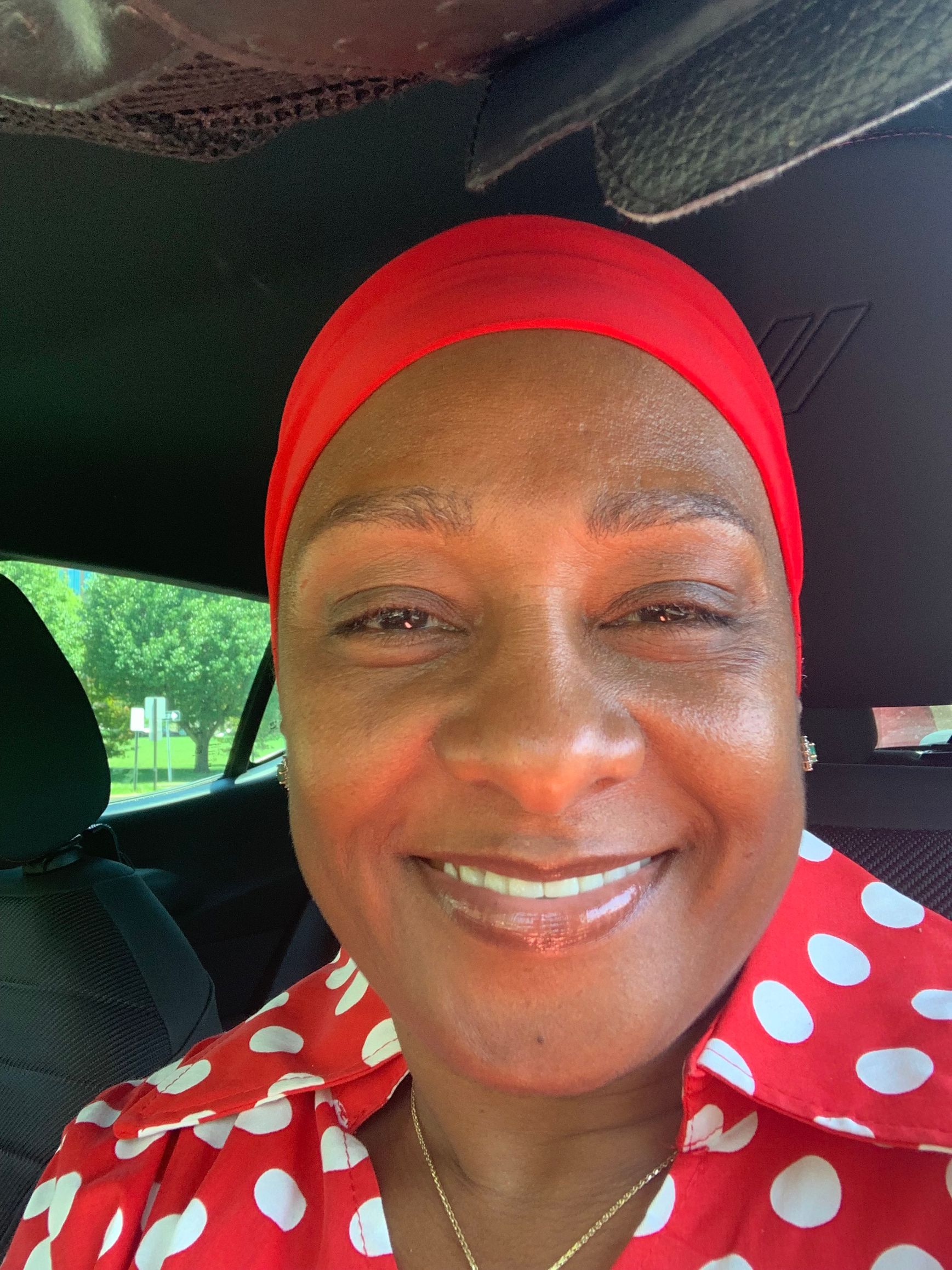 A doctor and a patient are looking at a tablet.