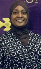 A woman is sitting next to an elderly man in a wheelchair.