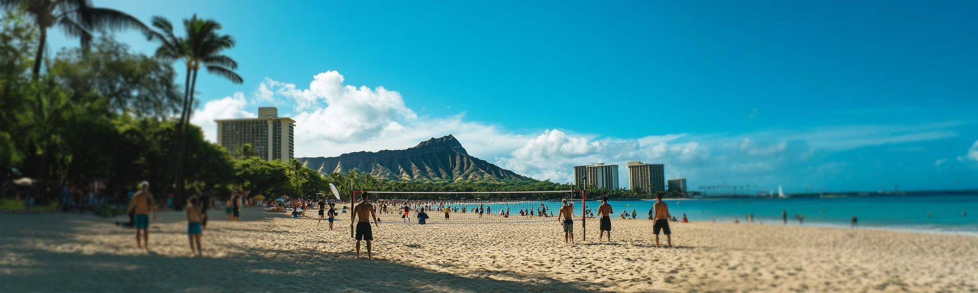 A blurry picture of people playing volleyball on a beach.
