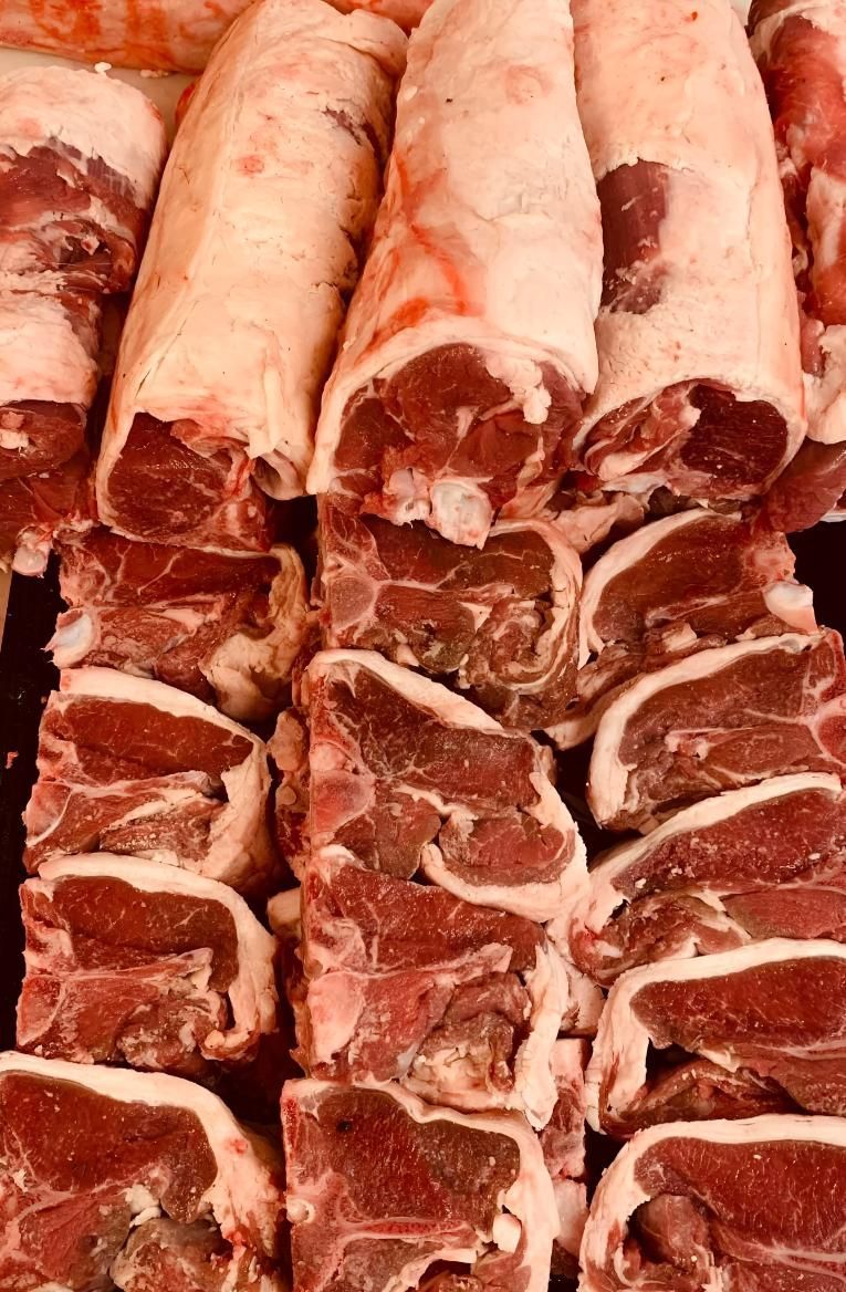 A Pile of Raw Meat is Sitting on a Table — MBW Wholesale & Bulk In Cannonvale, QLD