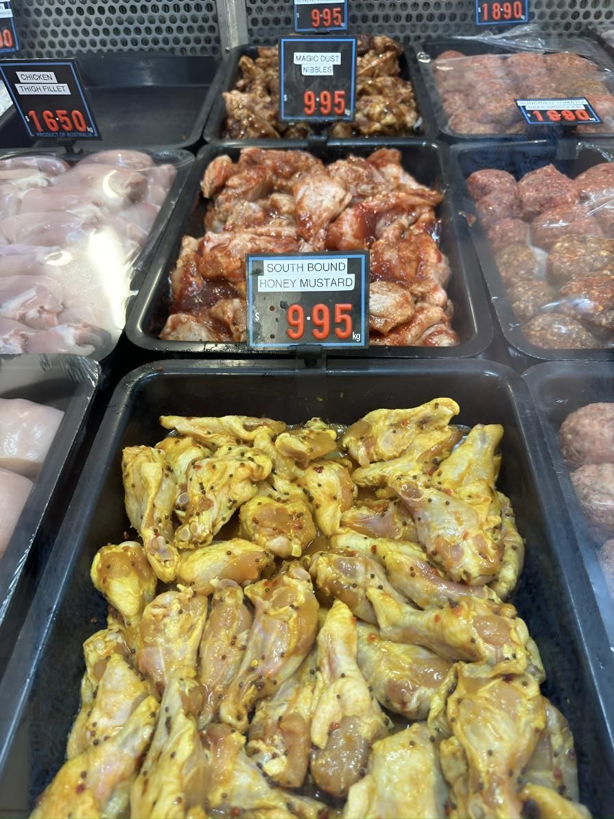 A Display of Chicken Wings With a Price Tag of 9.95 — MBW Wholesale & Bulk In Cannonvale, QLD