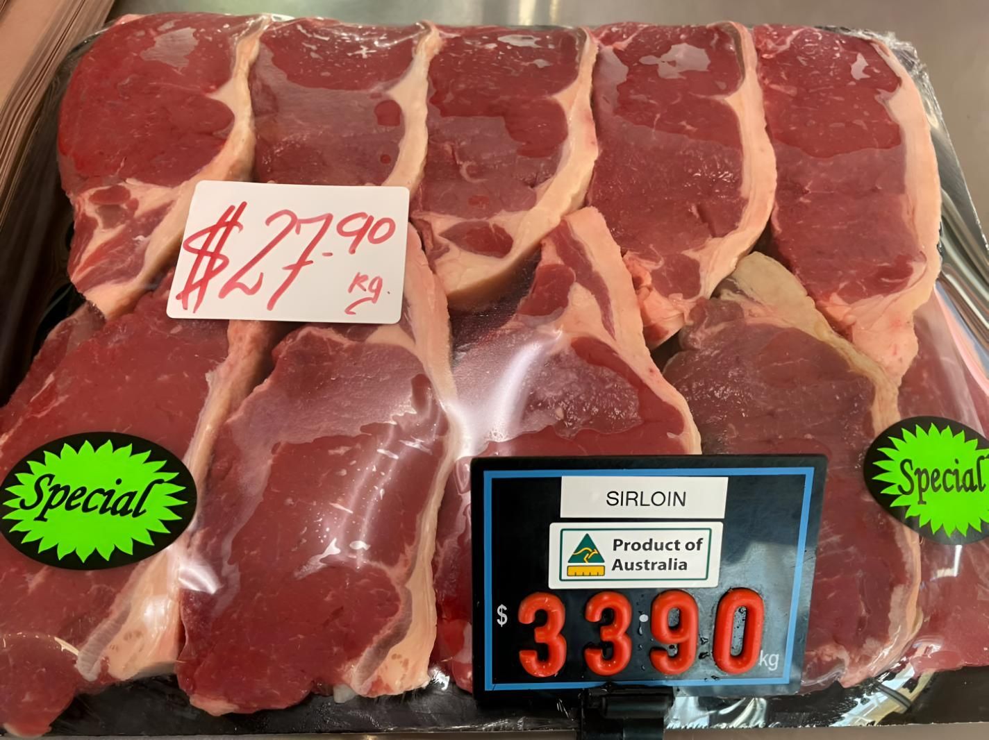 Packaged sirloin steaks for sale, price $33.90/kg, with a special label.— MBW Wholesale & Bulk In Cannonvale, QLD