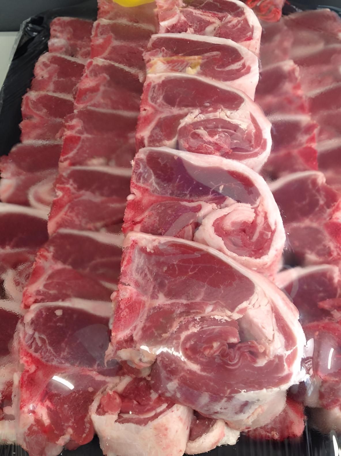 A Tray of Raw Lamb Chops Sitting on a Table — MBW Wholesale & Bulk In Cannonvale, QLD