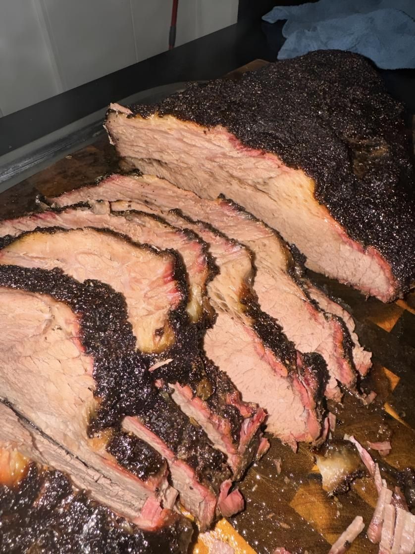 A Large Piece of Meat is Sitting on a Cutting Board — MBW Wholesale & Bulk In Cannonvale, QLD