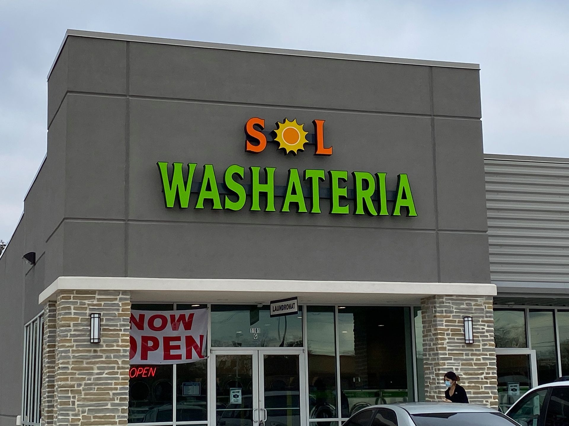 Sol Washateria storefront with orange 