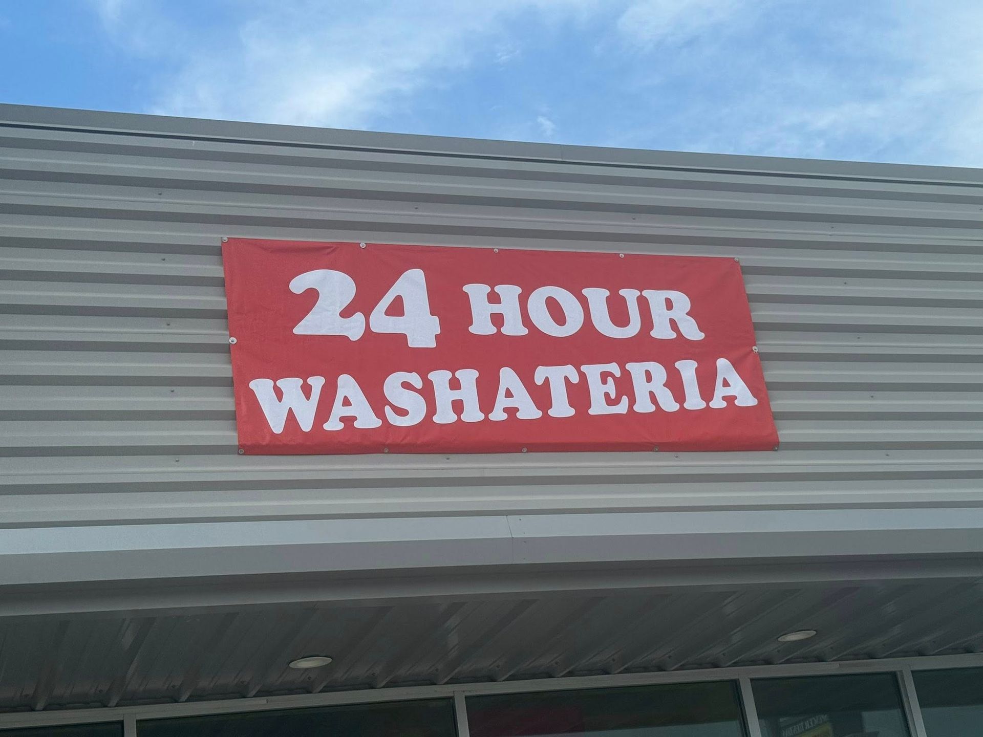 Red sign on a building: 