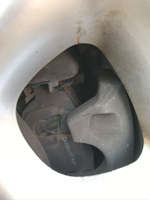 mechanic servicing brakes