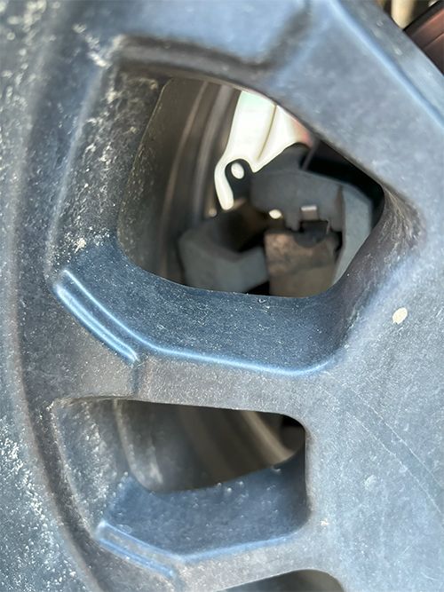 mechanic replacing disk brakes after customer states noise complaints