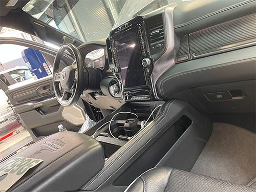 mechanic fixing a heater core on a 2020 ram truck, dashboard reinstalled