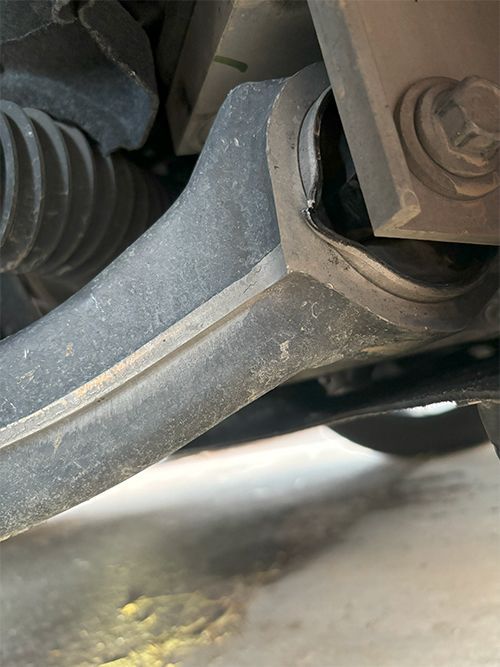 damaged vehicle control arm on vehicle