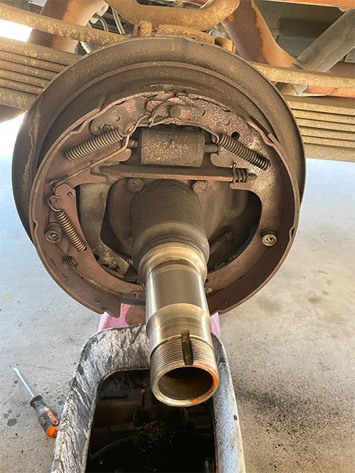 mechanic replacing drum brakes