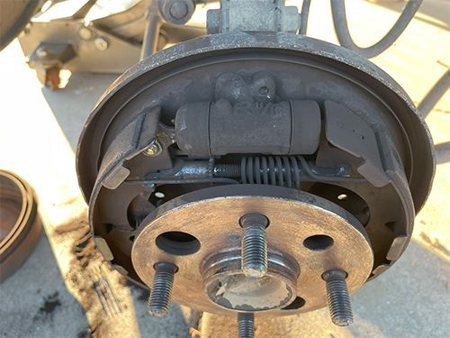 mechanic replacing drum brakes