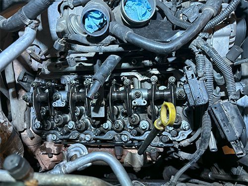 mechanic replacing an injector on a Duramax diesel truck