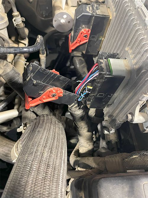 mechanic fixing a Broken PCM connector