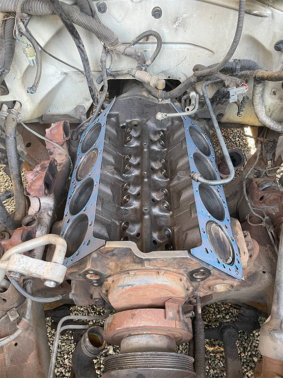 mechanic replacing engine gaskets