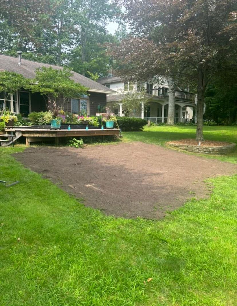 A large house with a large lawn in front of it