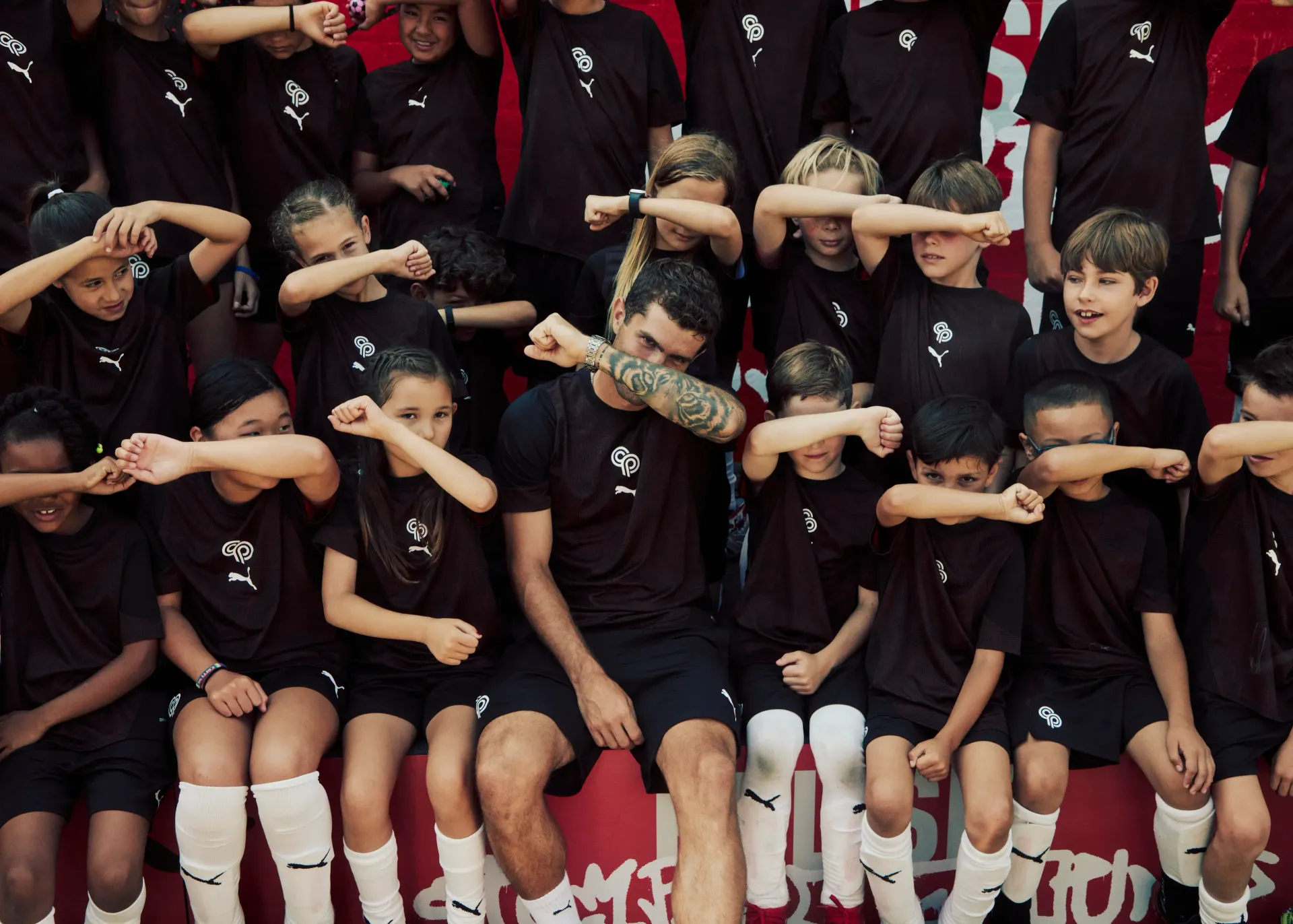 Soccer field with goal and ball; text 