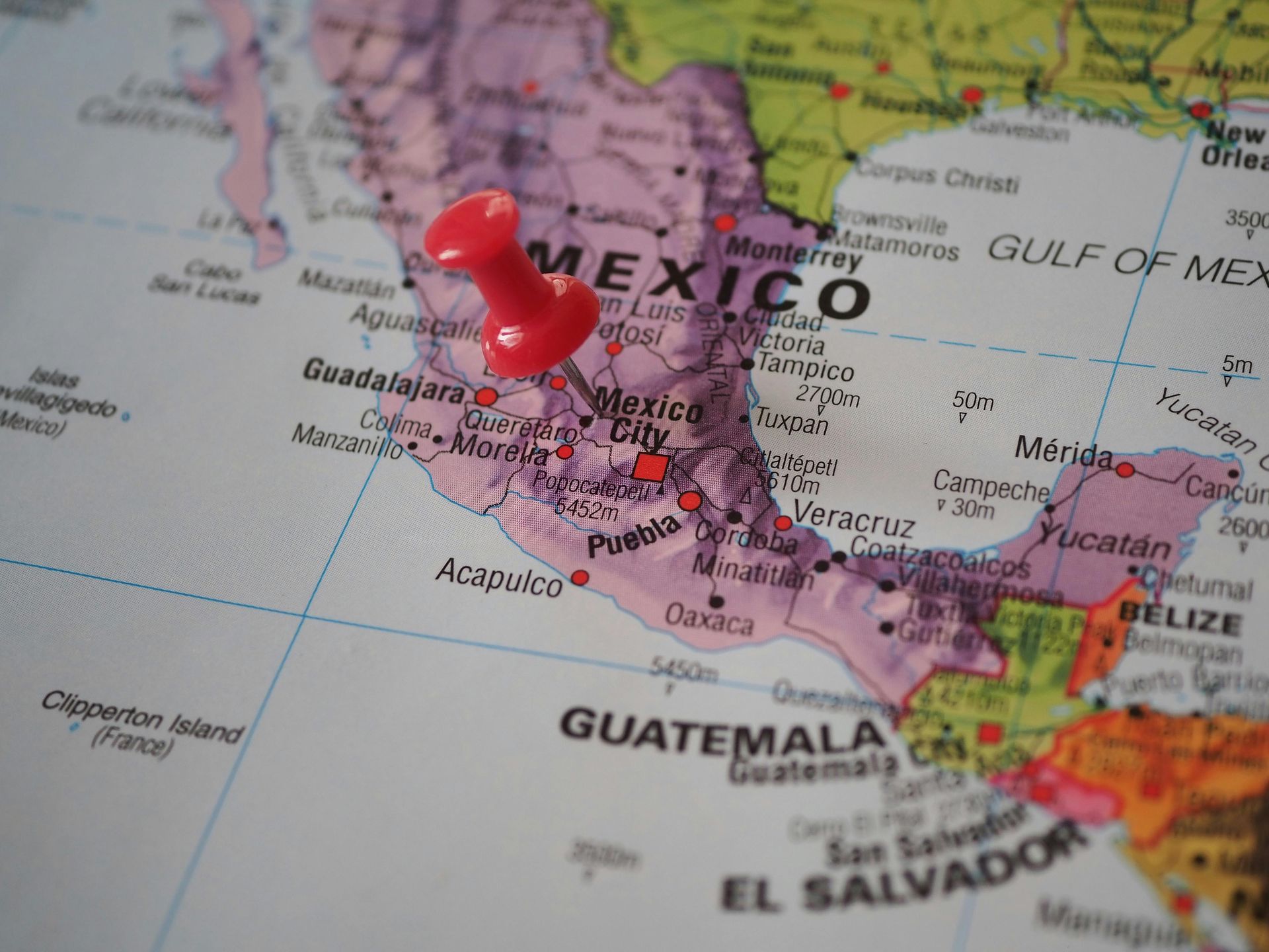 A map of mexico with a red pin on it
