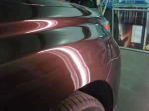 Maroon Car After Repairing Dent — Montrose, CO — The Dent Doctor