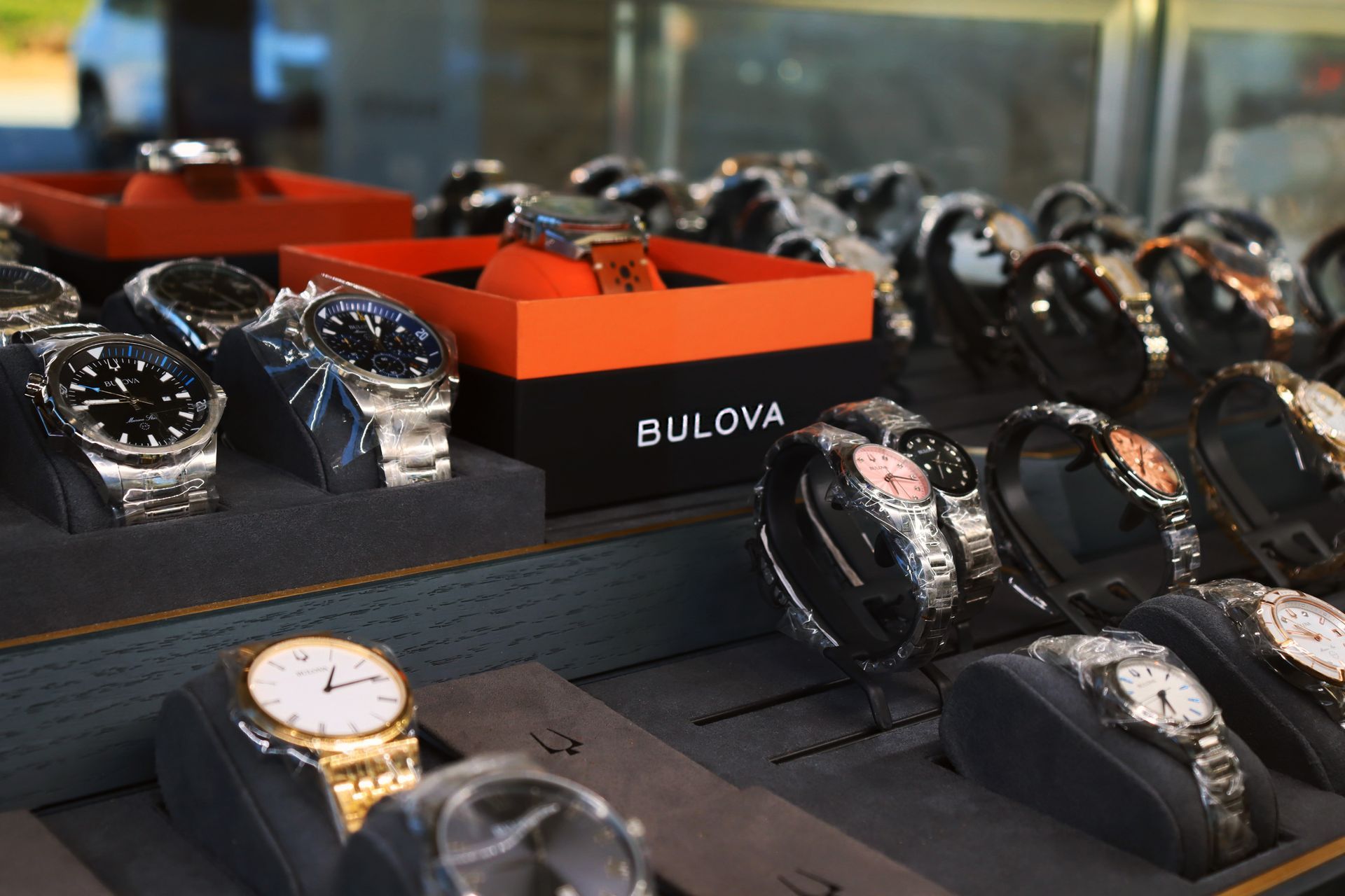 A bunch of bulova watches on display in a store