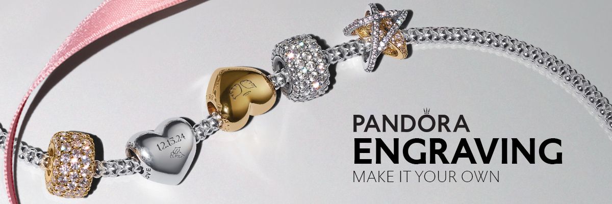 Pandora bracelet with charms on a white surface. Text says