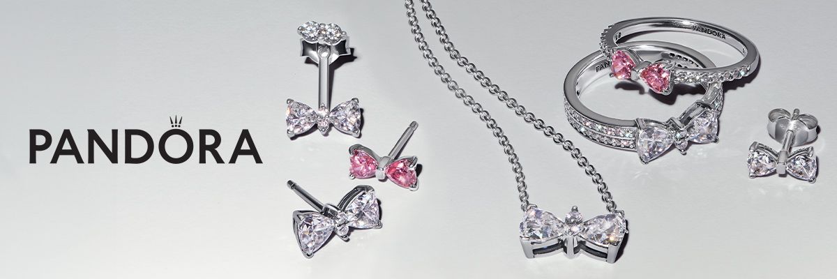 Pandora jewelry: bow-shaped earrings, necklace, and rings on a white background.