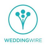 A logo for a wedding wire company with a flower in a circle.