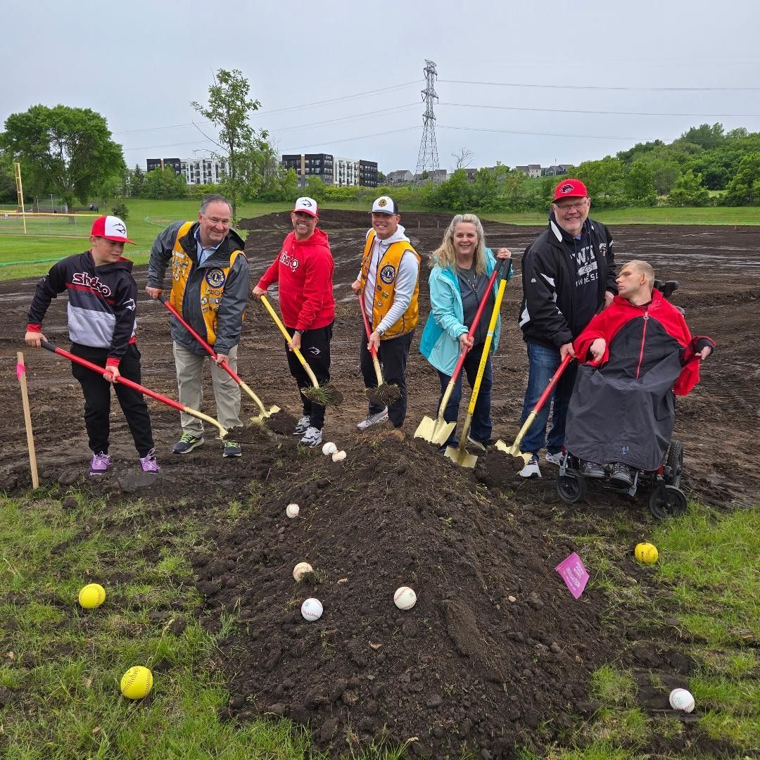 Community groundbreaking ceremony with golden shovels