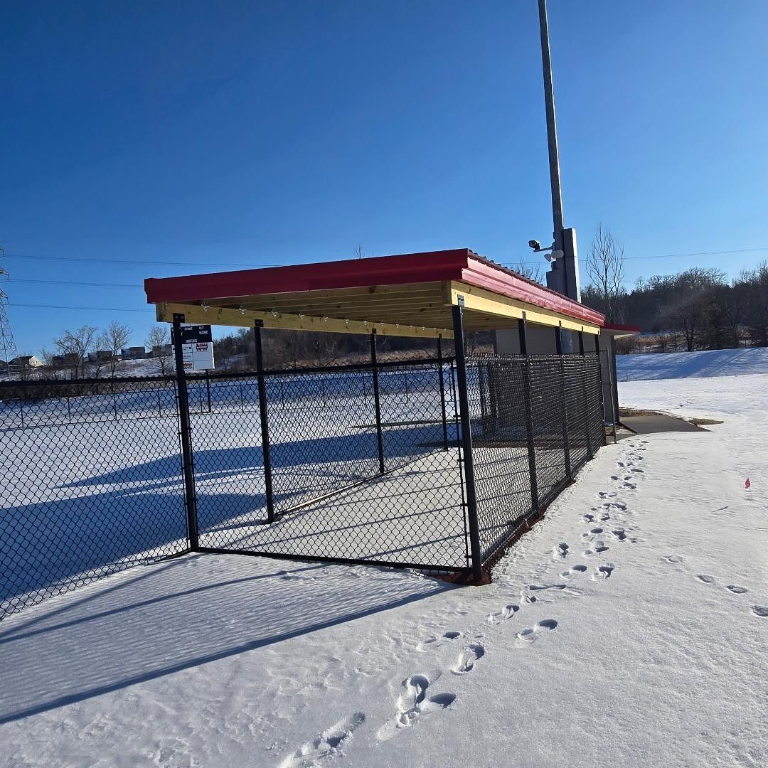 Finished dugouts with red and gold roofs in winter