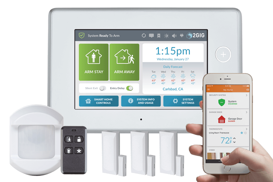 A person is holding a cell phone in front of a security system.