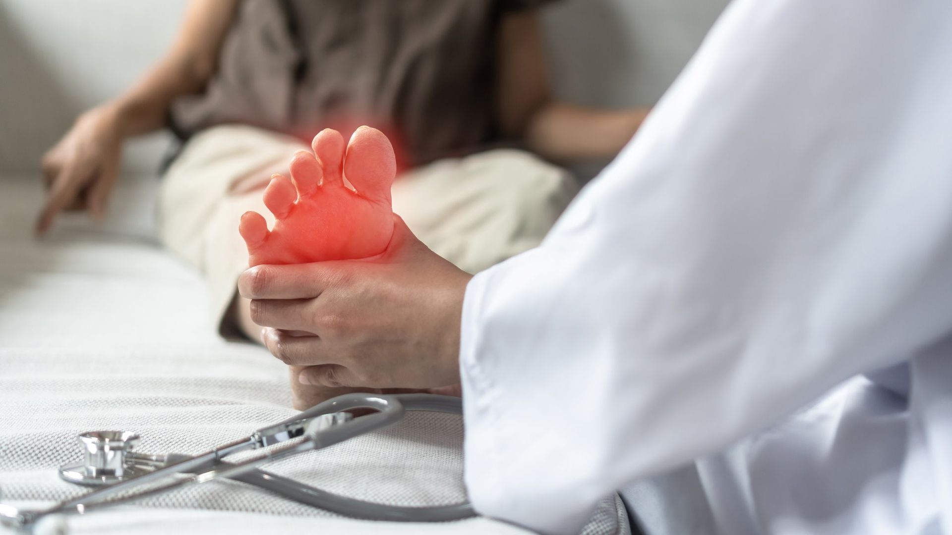 A Doctor Is Examining A Patient's Foot With A Stethoscope — Maitland Central Podiatry In Maitland NSW