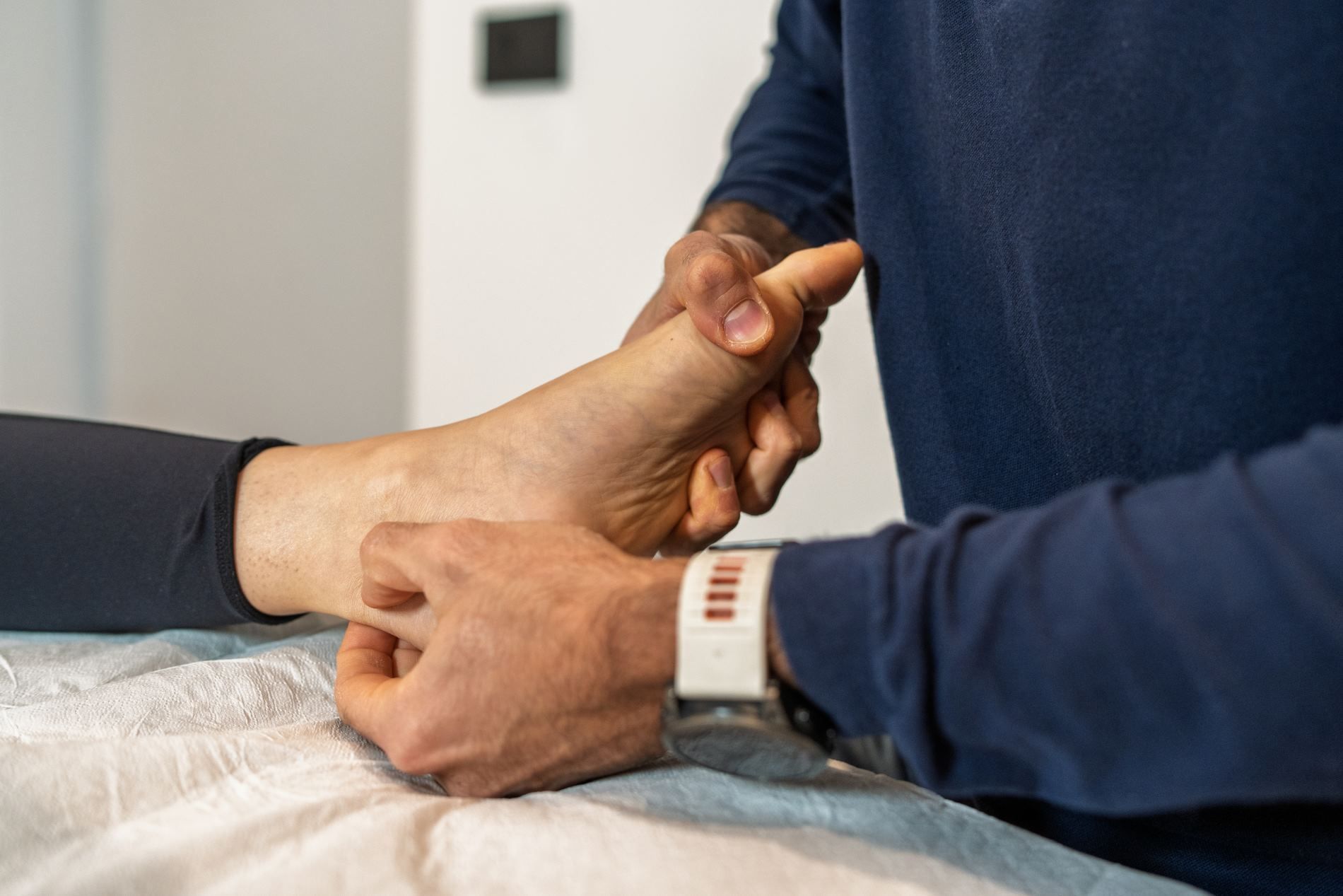 A Person is Getting Their Foot Examined by a Doctor — Maitland Central Podiatry in Maitland NSW 