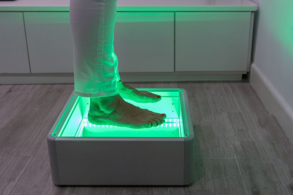 A Person is Standing on a Box With Their Feet on It — Maitland Central Podiatry in Maitland NSW