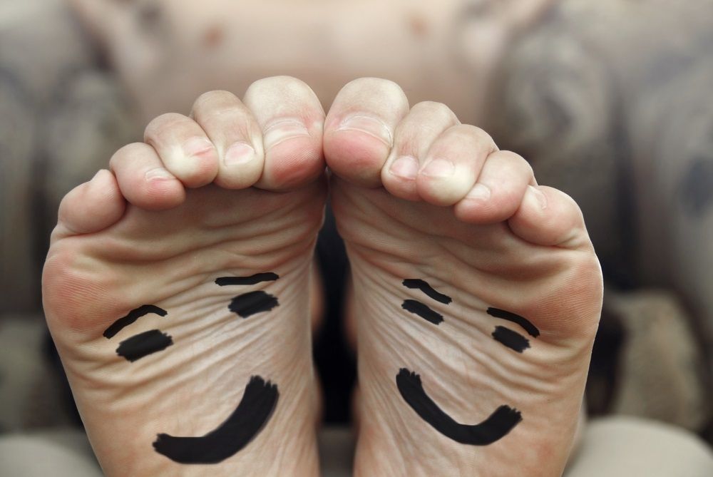 A Person Has Smiley Faces Painted on Their Feet — Maitland Central Podiatry in Maitland NSW