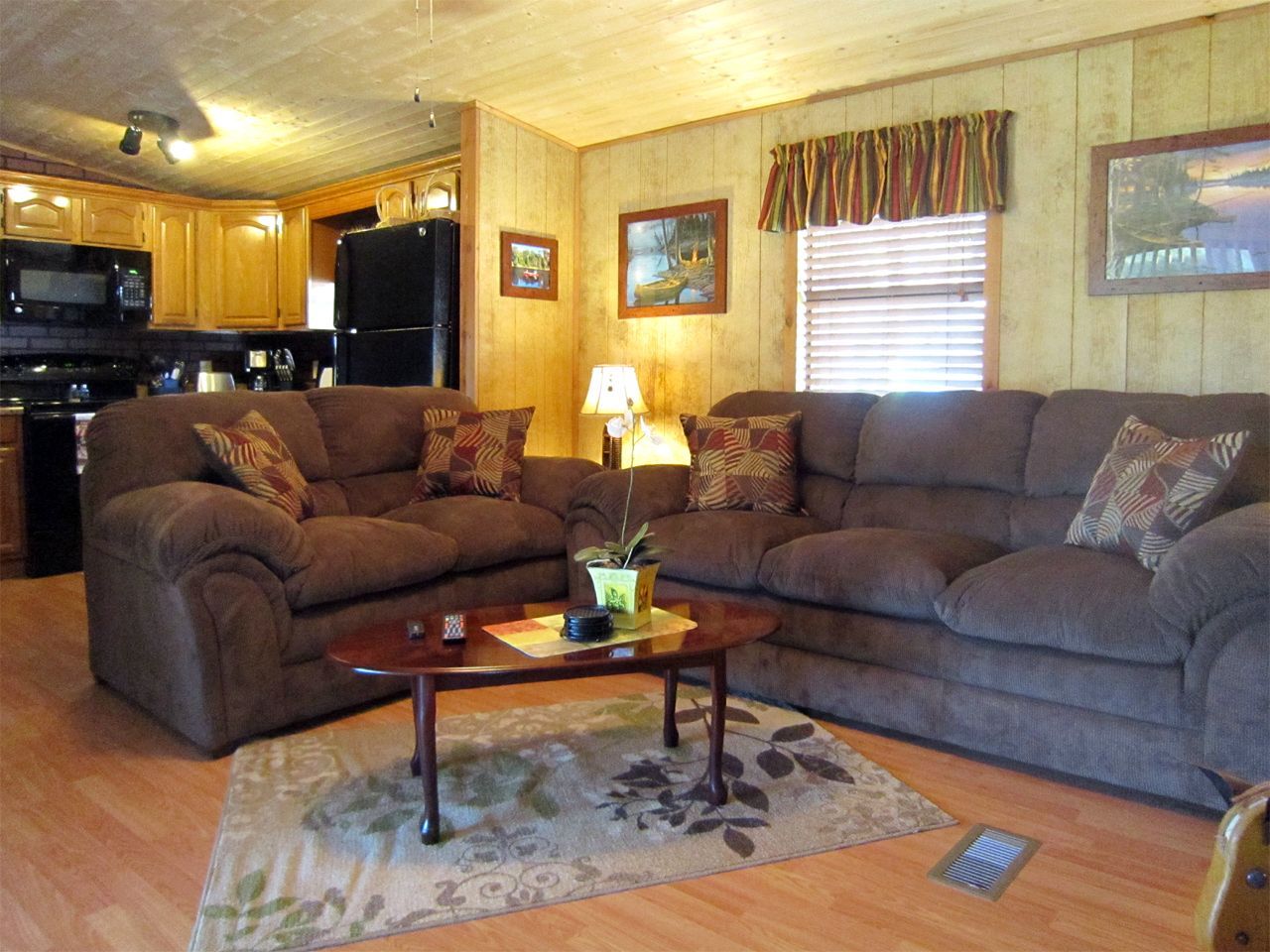 a living room with two couches and a coffee table