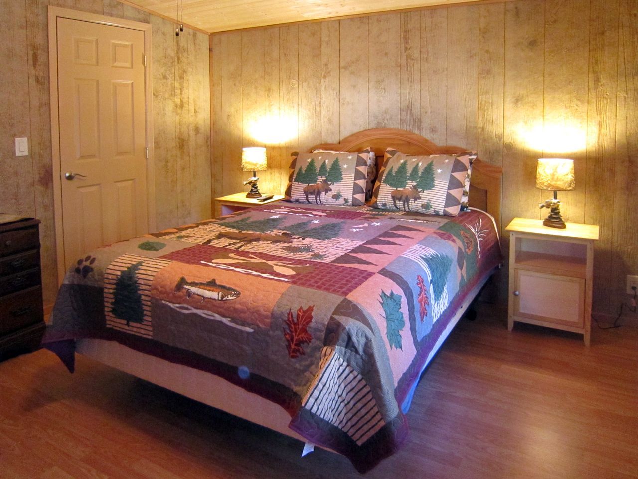 a bedroom with a king size bed and two nightstands