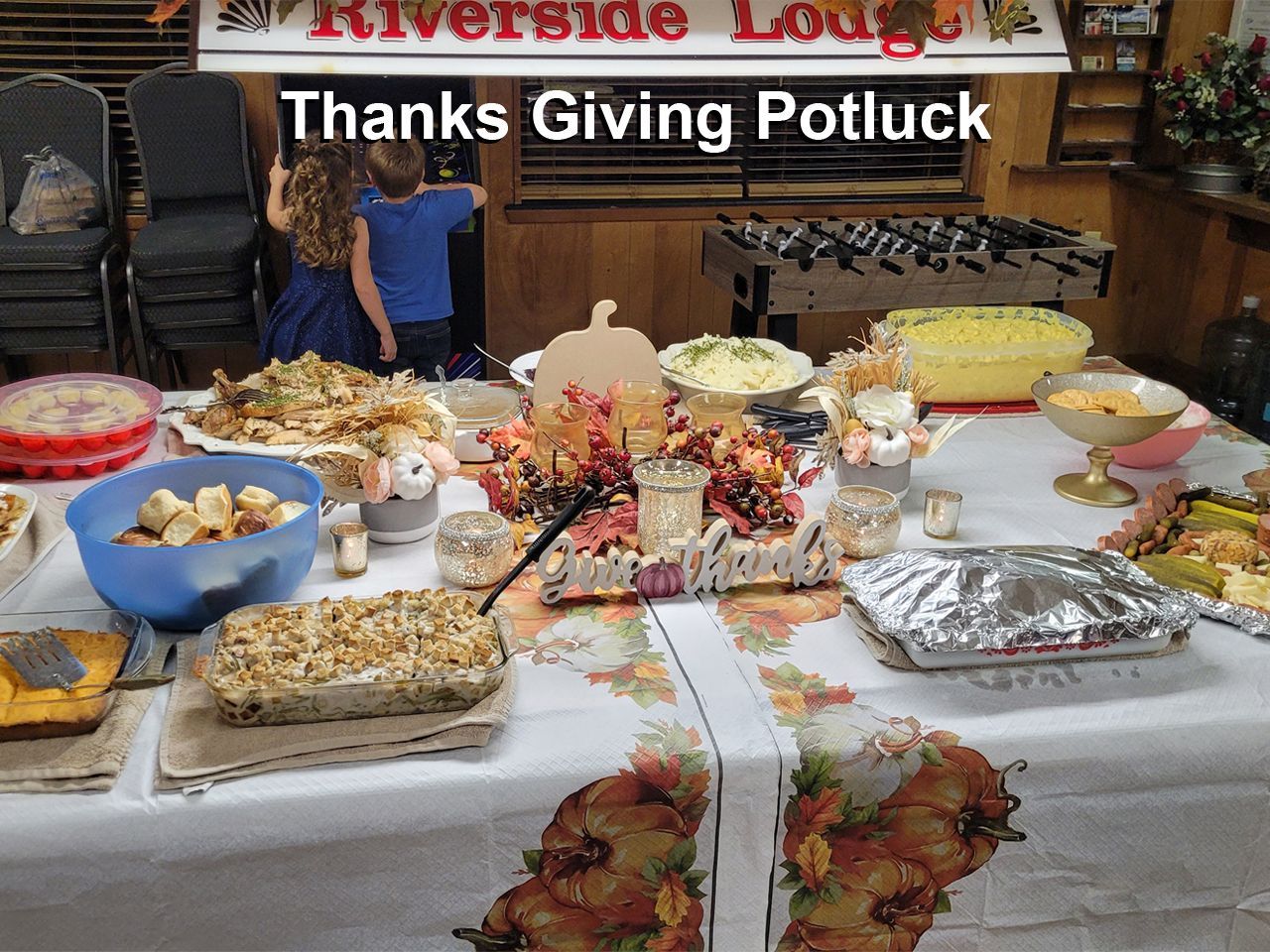 a thanksgiving potluck is being held at the riverside lodge