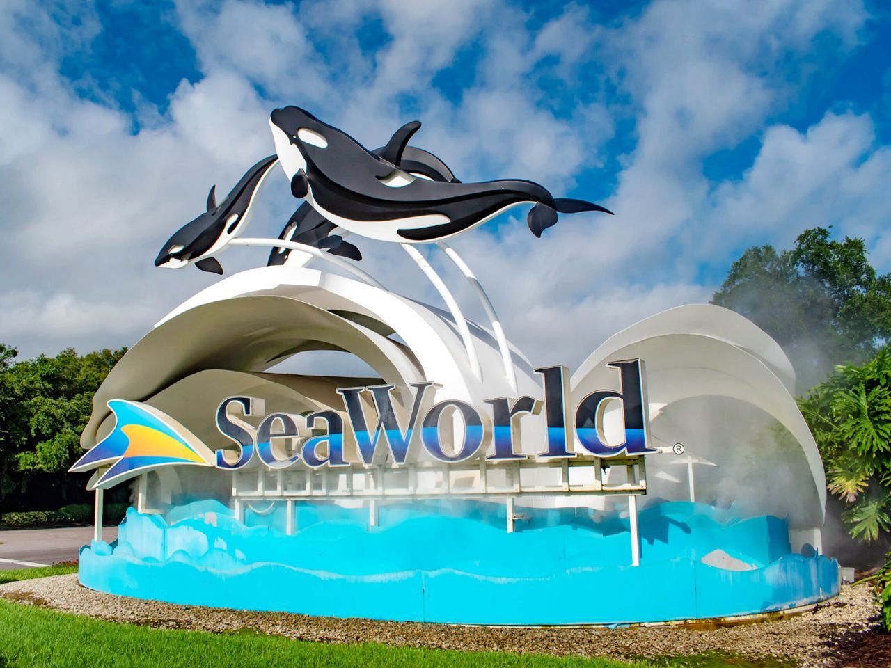 a seaworld sign with two killer whales on it