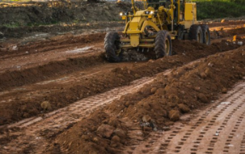 Grader is working on construction site in Cheyenne