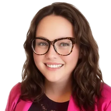 Melinda Wetherington wearing glasses and a pink jacket smiles for the camera