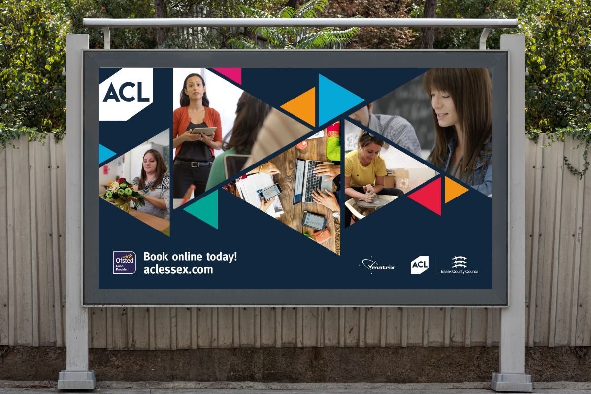 A billboard for acl is hanging on a wooden fence