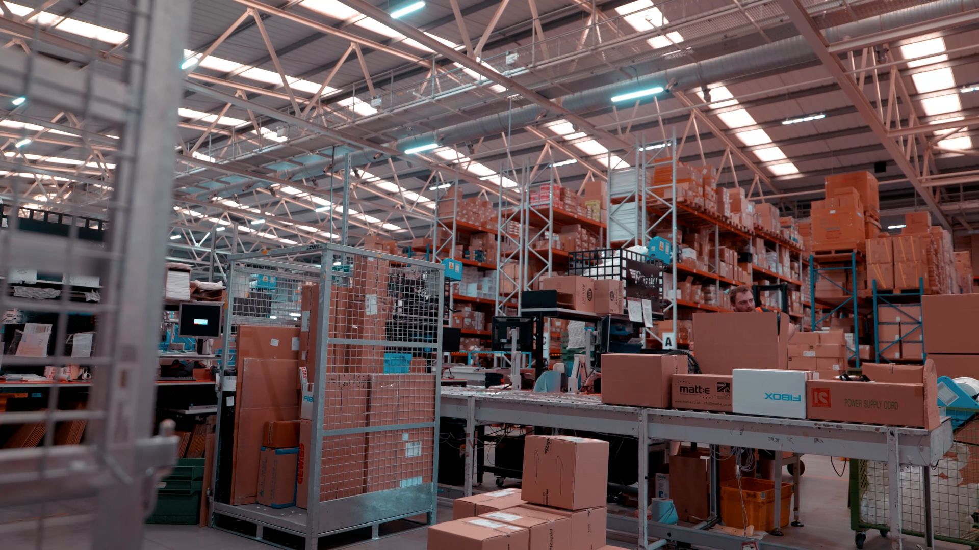 A large warehouse filled with lots of boxes and shelves.