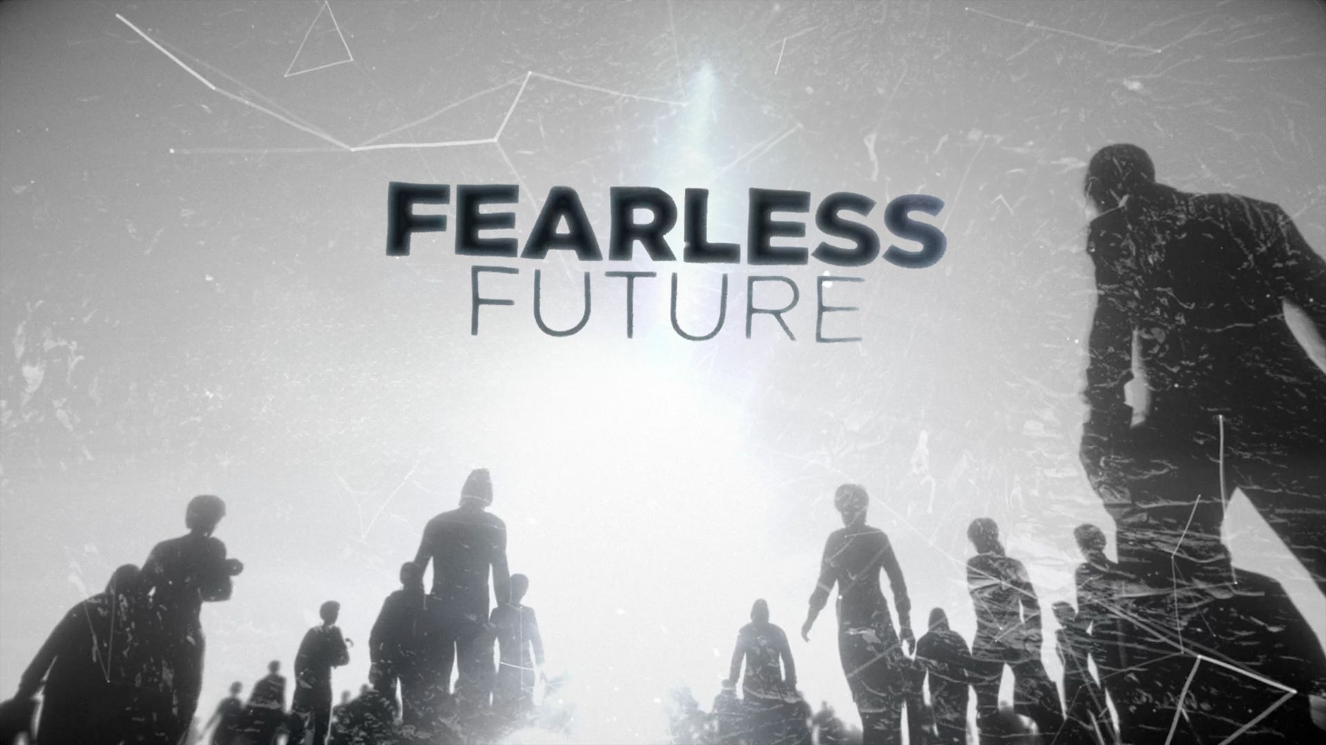 A group of people are standing in front of a sign that says fearless future.