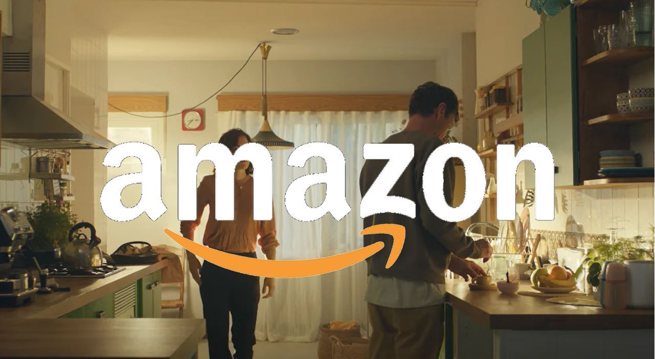 A man and woman are cooking in a kitchen with the amazon logo in the background.