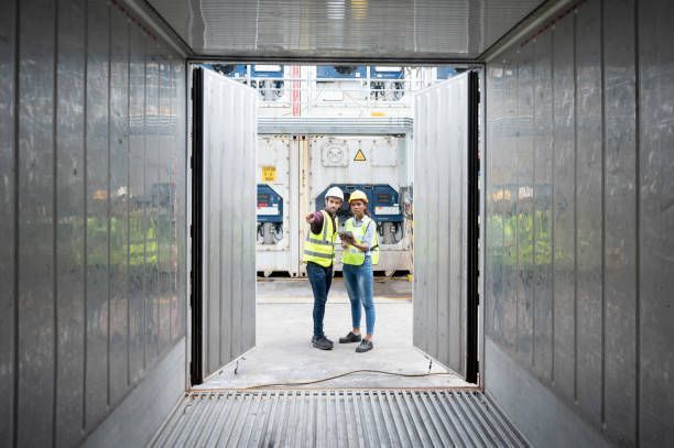 Reefer technician is cooperation working at container shipping terminal.