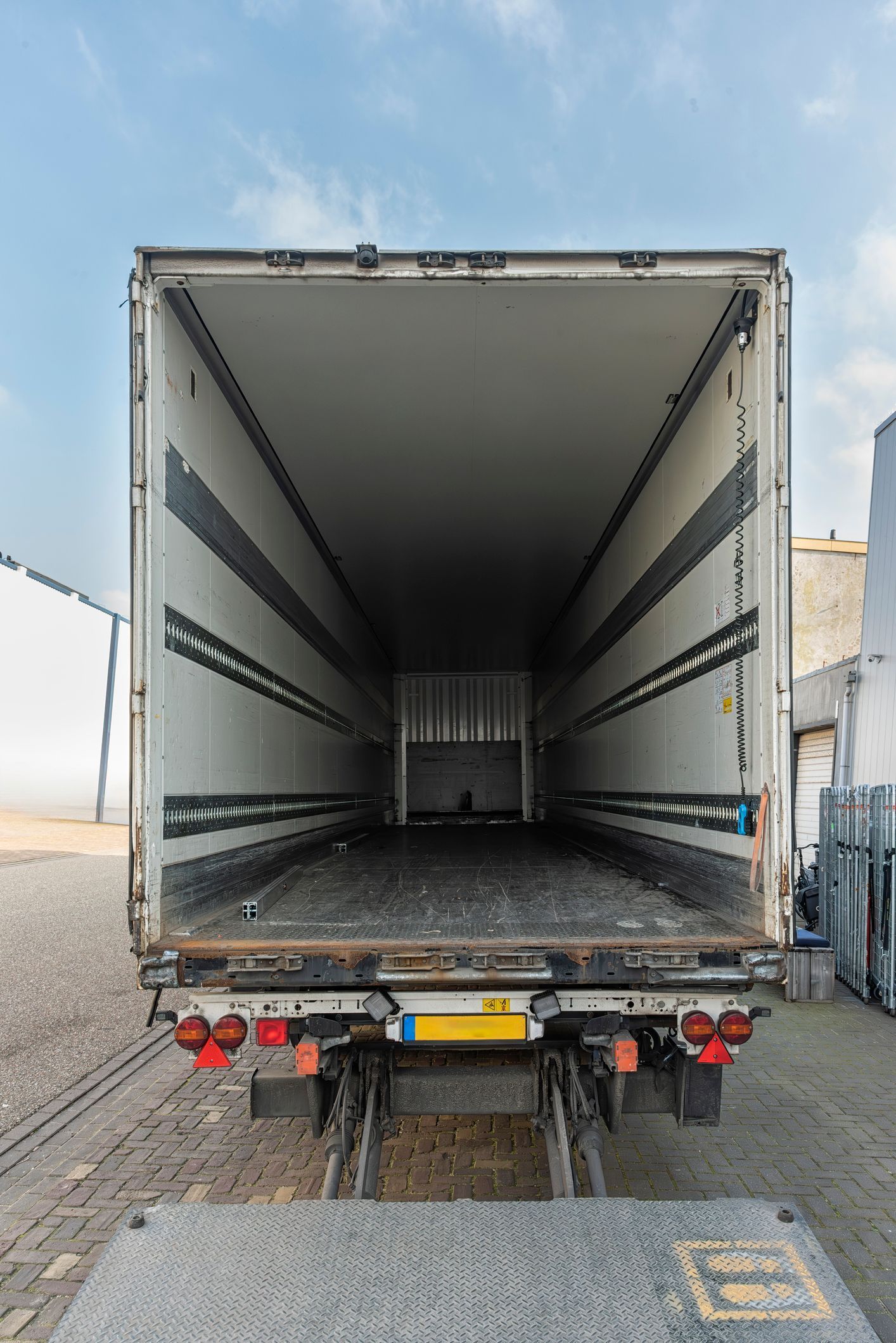 Rear view of a refrigerated semi-trailer.