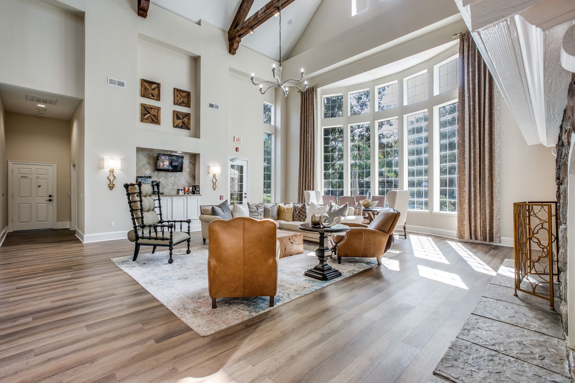 Apartment clubhouse filled with furniture and lots of windows at Marquis Champions Forest offers pet-friendly apartments  in Houston, TX.