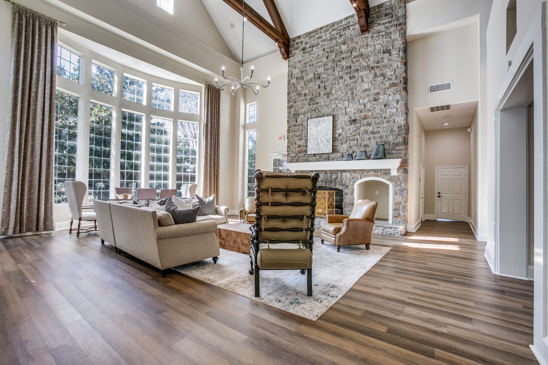 Resident lounge filled with furniture and a fireplace at Marquis Champions Forest offers pet-friendly apartments for rent in Northwest Houston, TX.