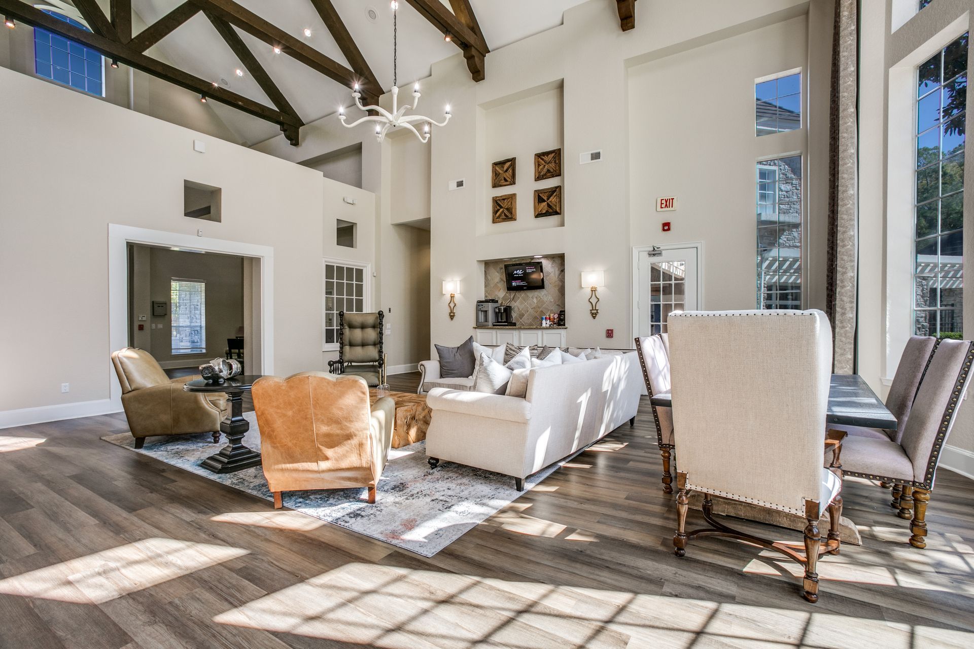 Clubhouse filled with furniture and a dining area at Marquis Champions Forest offers pet-friendly apartments in Northwest Houston, TX.